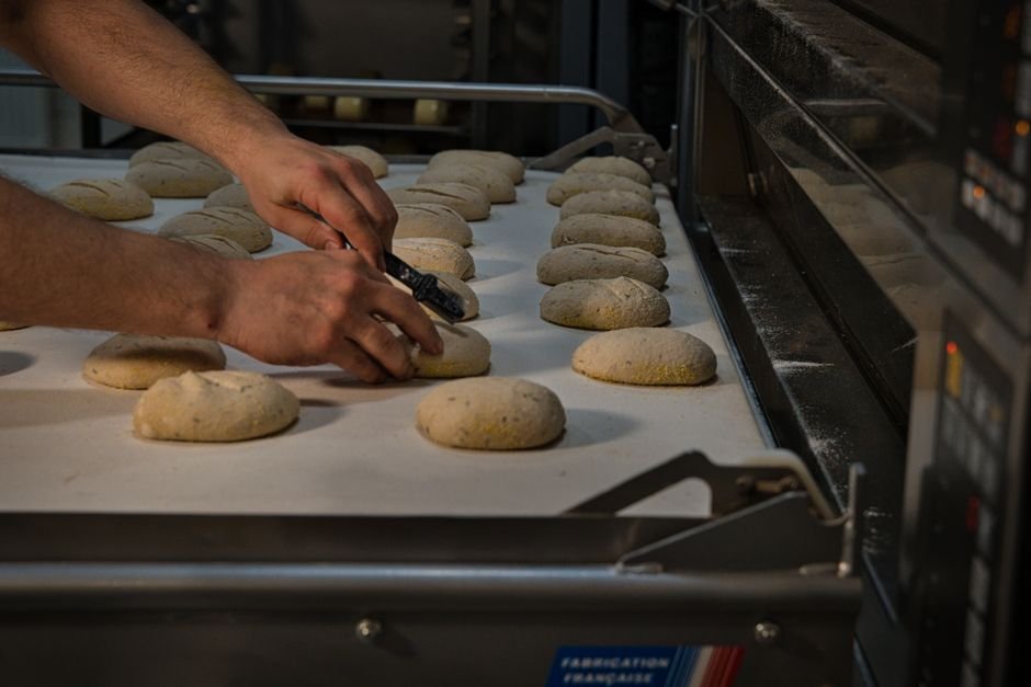 Products moving through an industrial baking line