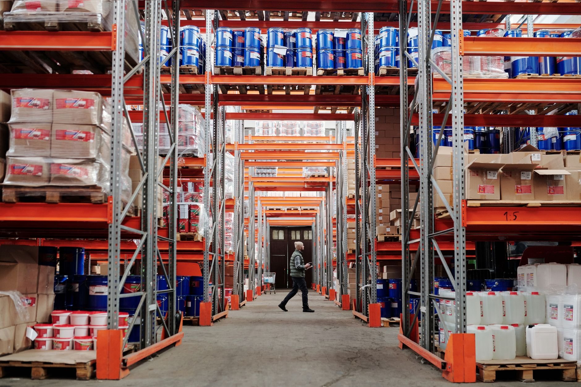 Warehouse storage racks with goods on pallets